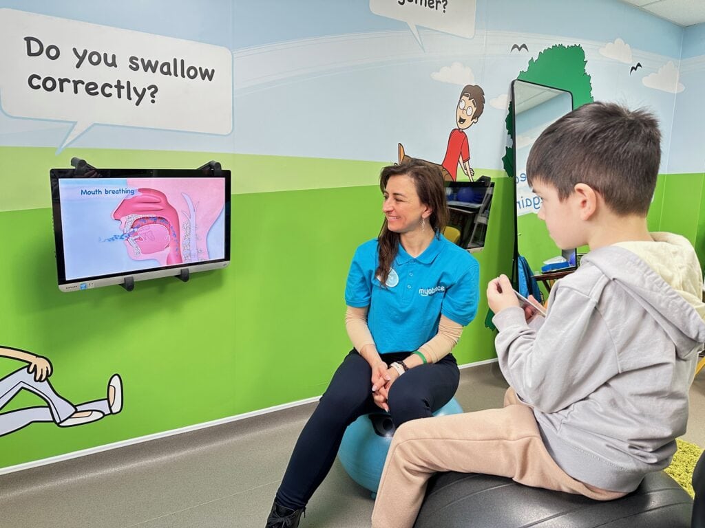 Myobrace Educator Aura conducting a Myobrace consultation with a child patient at Optident Dental Clinic's dedicated Myobrace room in Colchester.