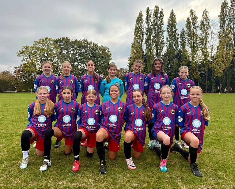 Wivenhoe Tempest Girl Team sporting their new Optident branded kits ahead of their football season